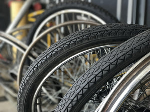 Row of bicycle tires and rims