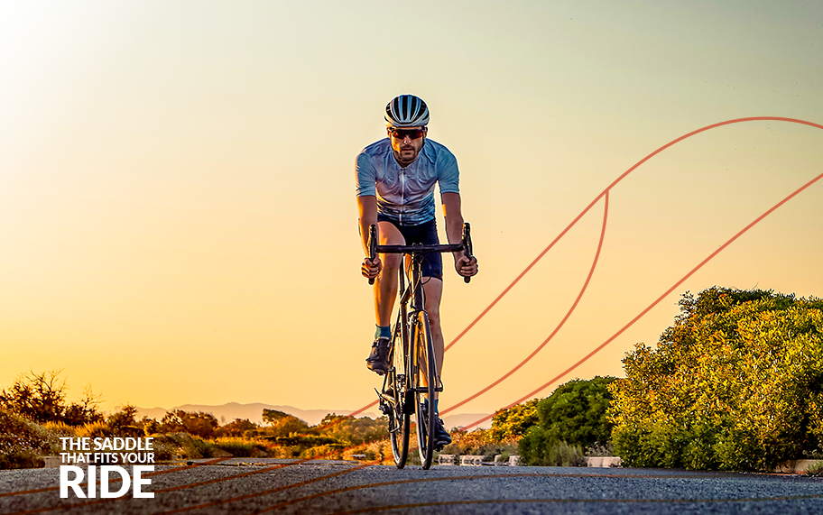 Man cycling at sunset
