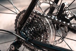Close-up of a rear bicycle cassette, disc brake and chain