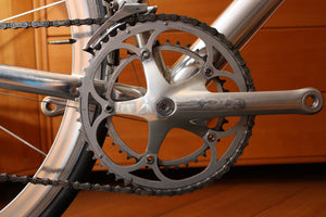 Close-up of the front chain rings and derailleur on a bicycle