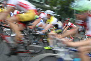 Group of cyclists speeding by in a blur