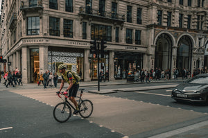 Cyclist riding through a city street intersection