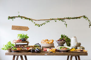 Variety of foods laid out decoratively on a farm table