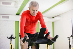 Older man working out on a stationary bike