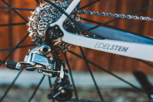 Close-up of rear bike cassette, chain and derailleur