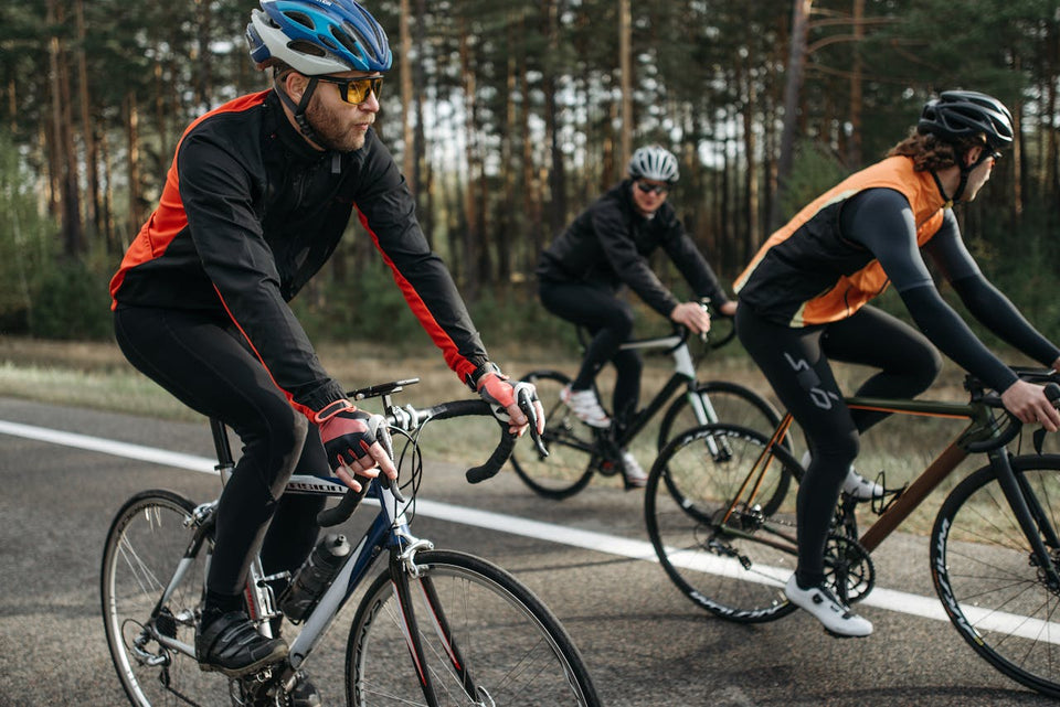 Group of cyclists pedaling together on a scenic outdoor road