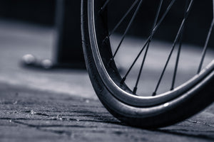 Close-up of a well-inflated bicycle tire on pavement
