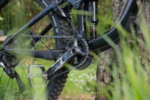Pedals and chain ring on a black mountain bike