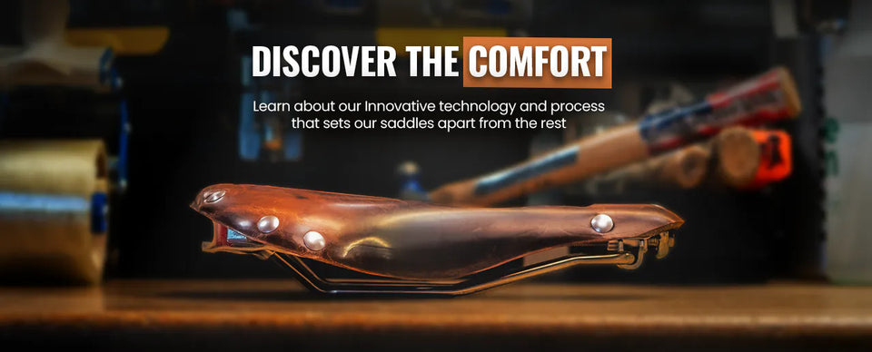 Profile view of a Selle Anatomica leather bike saddle. Text above says 'Discover the Comfort. Learn about our innovative technology and process that sets our saddles apart from the rest.'