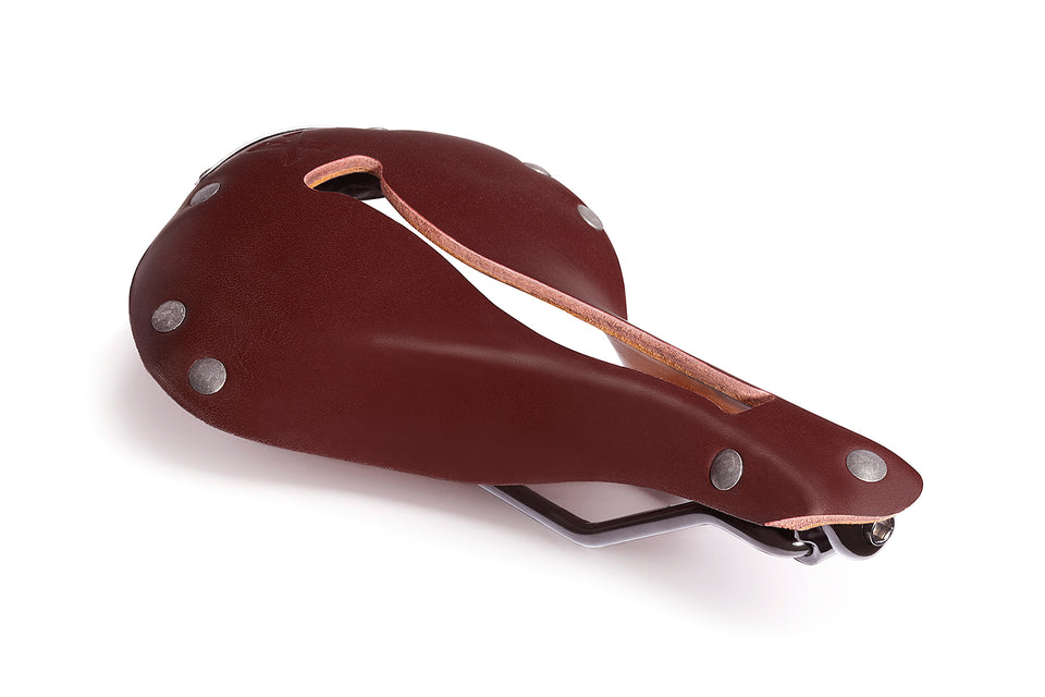 Selle Anatomica X1 reddish-brown oxblood leather bike saddle with gunmetal rivets and Flex-Fly slot for comfortable riding over distances