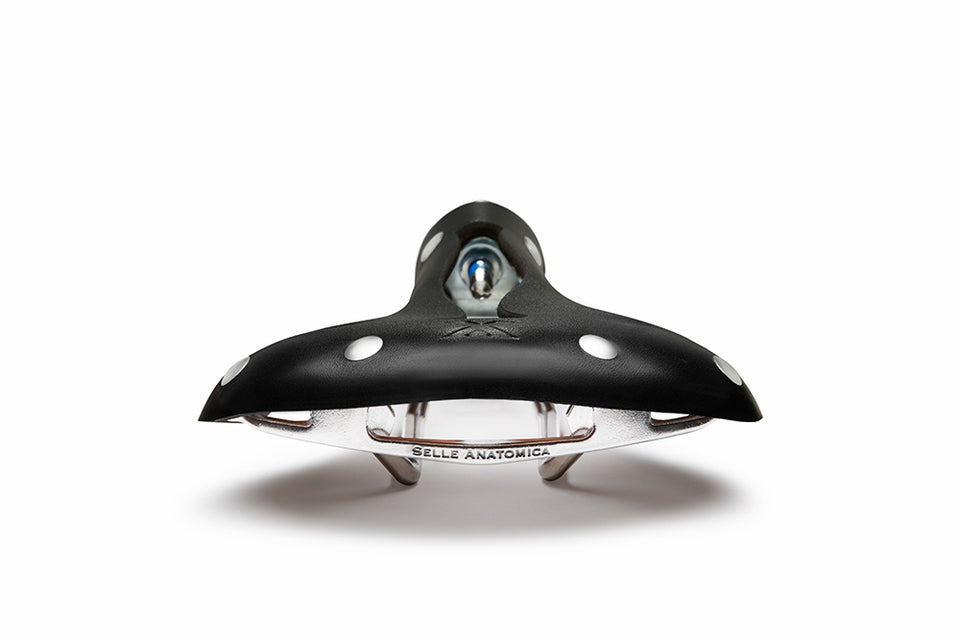Back side of the X2 road bike saddle in black leather with silver rivets, showing off the Selle Anatomica branding on the stainless alloy frame