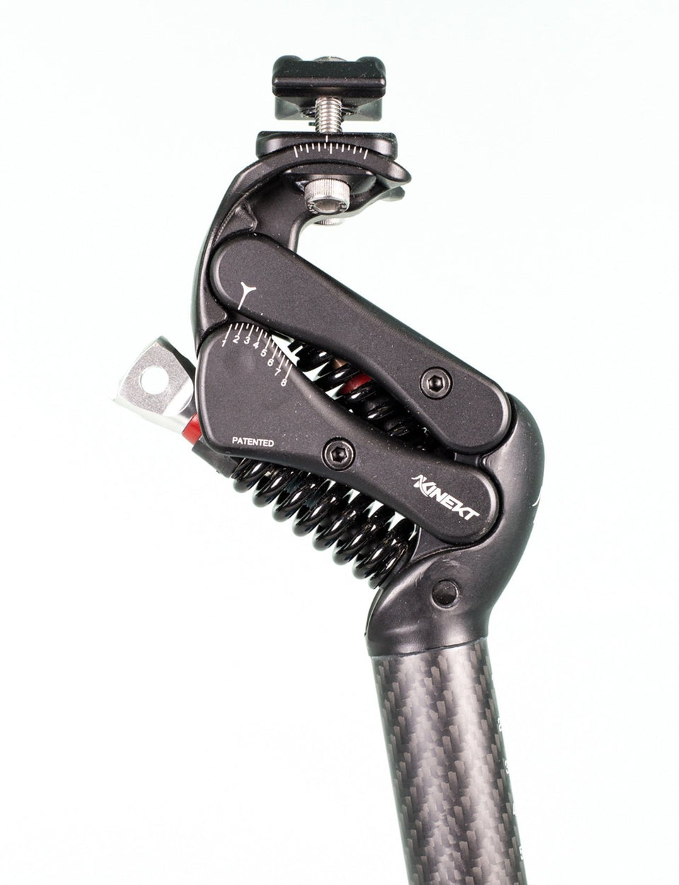 A closeup of an adjustable seatpost showing with shock absorbing springs and control knob